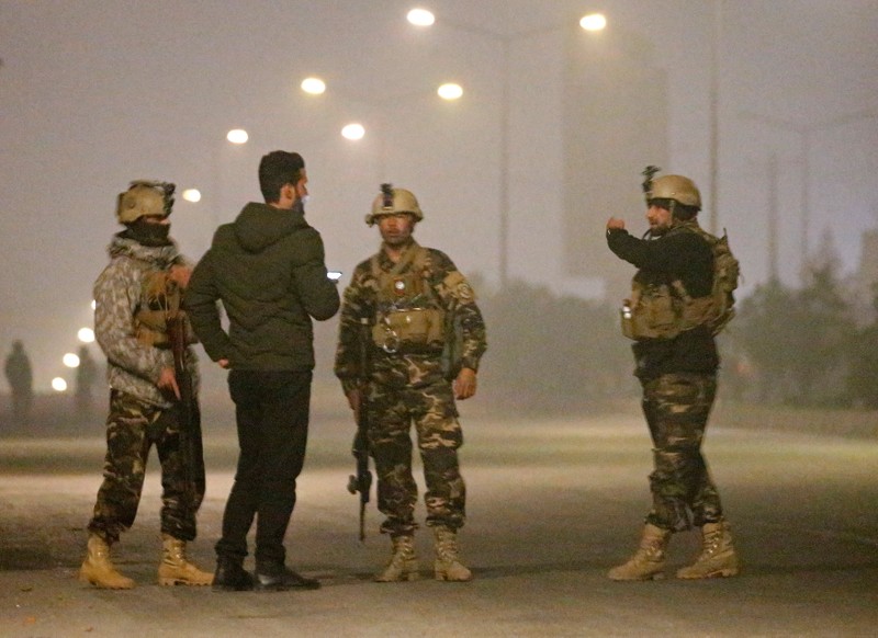 Afghan security force keep watch near the site of an attack on the Intercontinental Hotel in Kabul