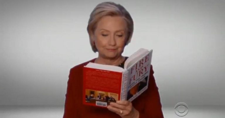 Hillary Clinton reads “Fire and Fury” during the Grammys