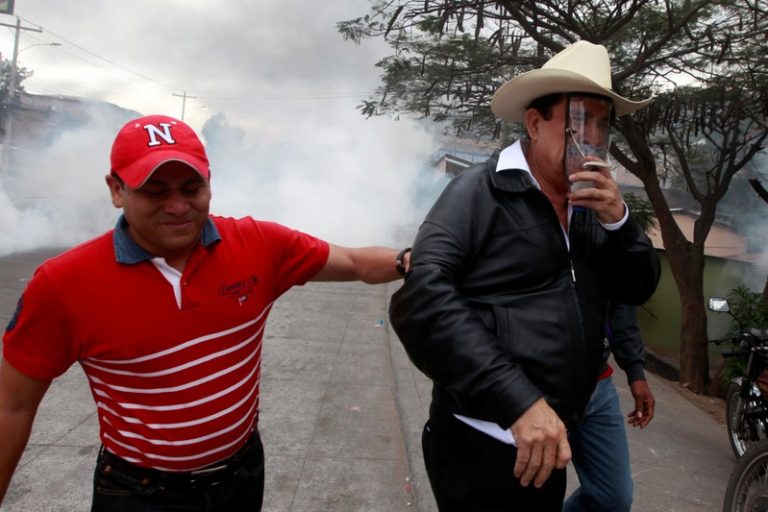 Honduran security forces battle protesters as election chaos lingers