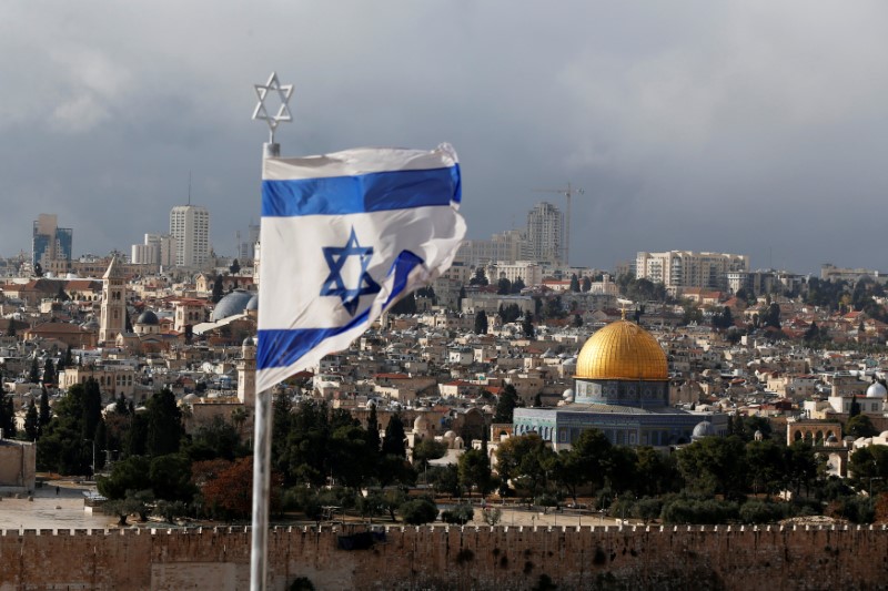 FILE PHOTO: An Israeli flag is seen near the Dome of the Rock, located in Jerusalem's Old City on the compound known to Muslims as Noble Sanctuary and to Jews as Temple Mount