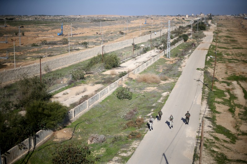 Palestinian security forces loyal to Hamas patrol near the border between Egypt and Gaza, in the southern Gaza Strip