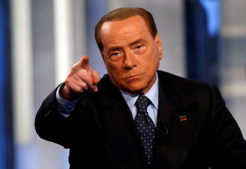 FILE PHOTO: Italy's former Prime Minister Silvio Berlusconi gestures as he attends television talk show 