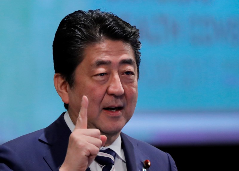 FILE PHOTO: Japan's Prime Minister Shinzo Abe attends Universal Health Coverage Forum 2017 in Tokyo