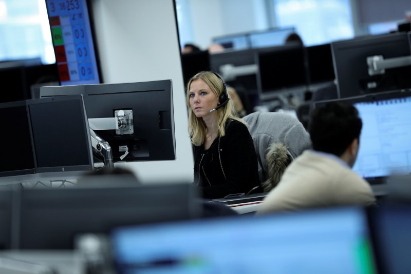 A broker works on the trading floor at IG Index in London