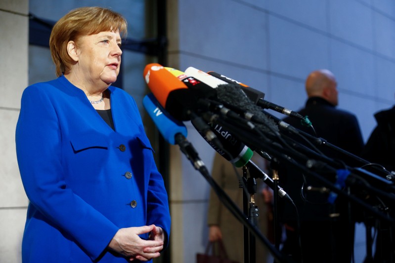 Acting German Chancellor Angela Merkel arrives for exploratory talks about forming a new coalition government at the SPD headquarters in Berlin