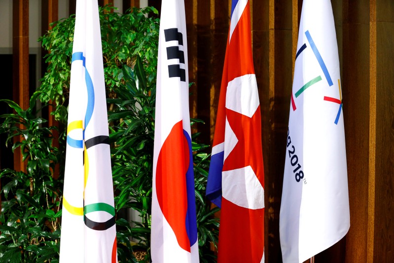 Flags of the International Olympic Committee, the Republic of Korea, the Democratic People’s Republic of Korea, and the PyeongChang 2018 Organising Committee are seeing at the IOC headquarters in Lausanne