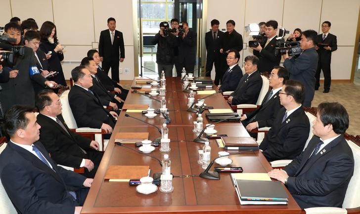 South and North Korean delegations attend their meeting at the truce village of Panmunjom