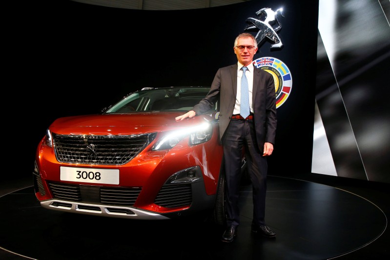 FILE PHOTO: Tavares, CEO of PSA Peugeot Citroen, poses with the Car of the Year Peugeot 3008 during the 87th International Motor Show at Palexpo in Geneva