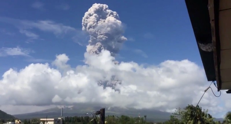 Ash cloud hovers over Mayon volcano, as seen from the Bicol Region