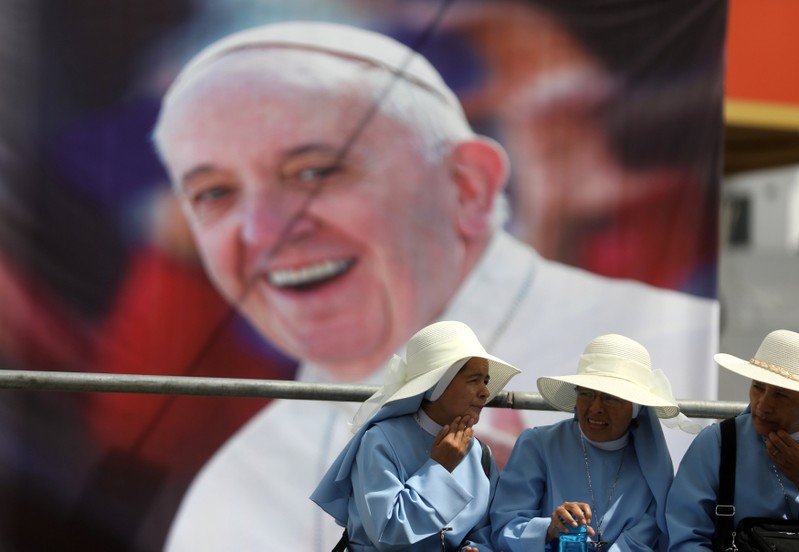 Nuns wait for Pope Francis to arrive, in Lima