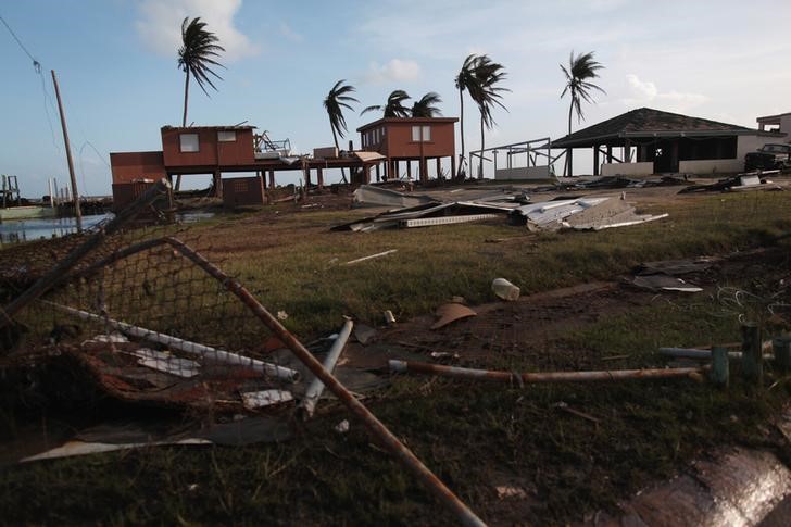 FILE PHOTO - Damaged houses are seen after Hurricane Maria hit the island in September, in Humacao