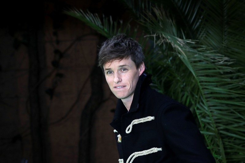 Actor Eddie Redmayne poses for photographs as he arrives at the world premiere of 'Early Man' in central London