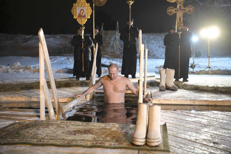 Russian President Putin takes a dip in the freezing waters of Lake Seliger during Orthodox Epiphany celebrations in Tver region