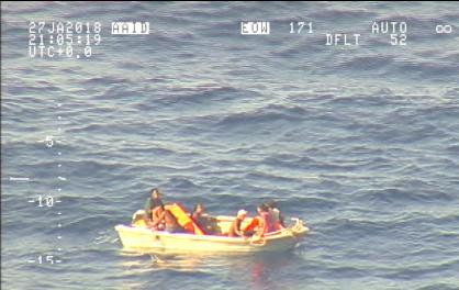 A handout photo supplied by the New Zealand Defence Force shows survivors from a ferry that sunk floating in a boat in the sea near the South Pacific nation of Kiribati