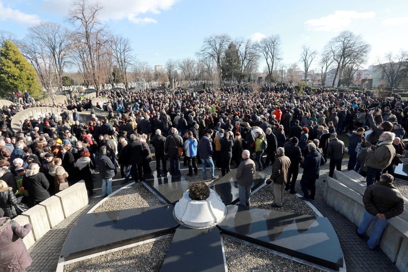 People attend the funeral of Oliver Ivanovic in Belgrade