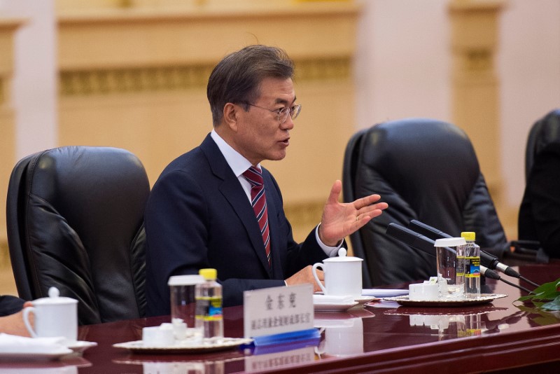 South Korea's President Moon Jae-In talks with China's Premier Li Keqiang at the Great Hall of the People in Beijing