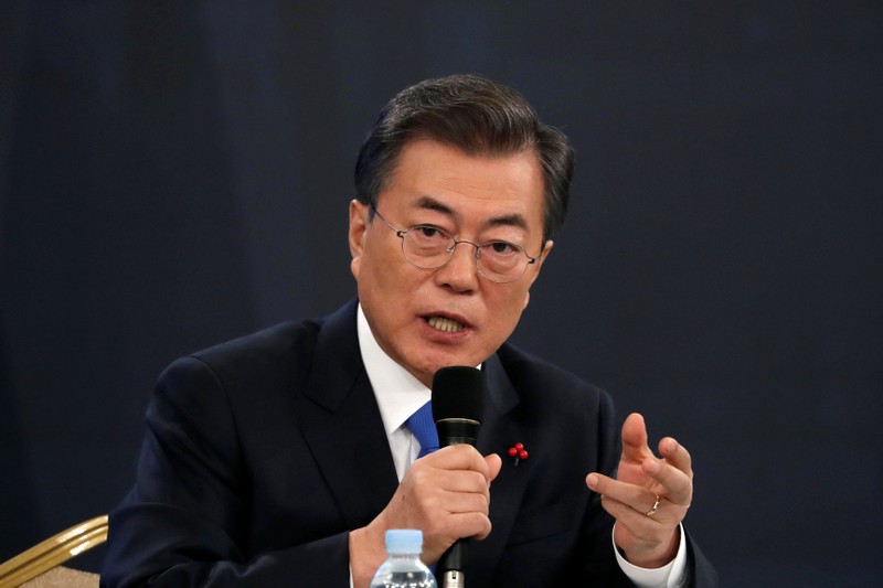 South Korean President Moon Jae-in answers reporters' question during his New Year news conference at the Presidential Blue House in Seoul