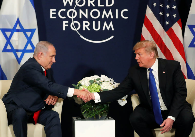 U.S. President Donald Trump shakes hands with Israeli Prime Minister Benjamin Netanyahu during the World Economic Forum (WEF) annual meeting in Davos