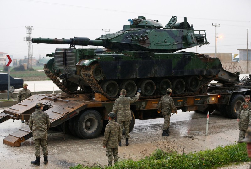 A Turkish military tanks arrives at an army base in the border town of Reyhanli near the Turkish-Syrian border in Hatay province