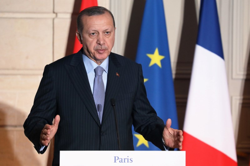 Turkish President Recep Tayyip Erdogan speaks during a joint press conference with the French president at the Elysee Palace in Paris