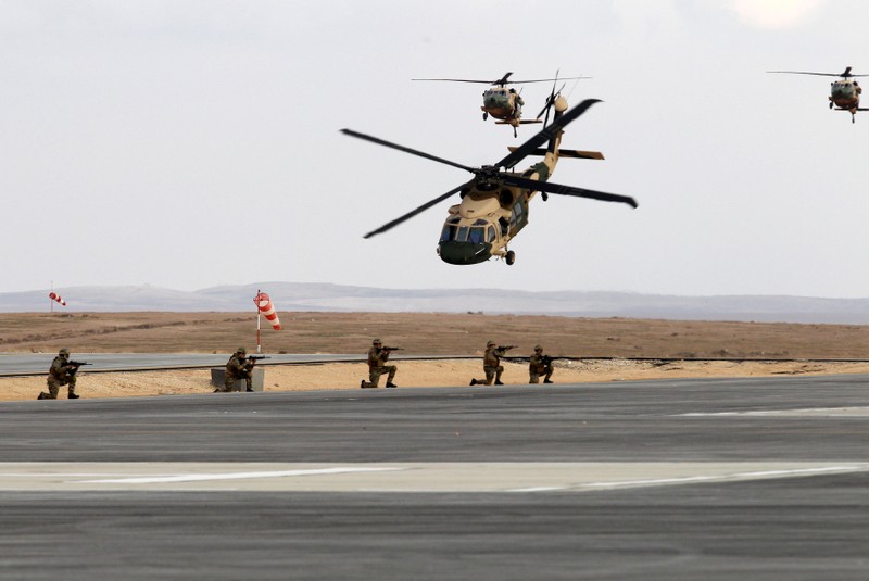 Jordanian army members participate in a hostage rescue drill during a Black Hawk helicopters handover ceremony to Jordan from the U.S. government, at a Jordanian military base near the town of Zarqa