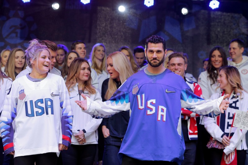 FILE PHOTO: Olympic hockey players Brianna Decker and Brian Gionta take part in an event in Times Square to celebrate 100 days from the start of the PyeongChang 2018 Olymphttp://stc.content.reuters.com/auth-server/content/tag:reuters.com,2018:newsml_RC16C2