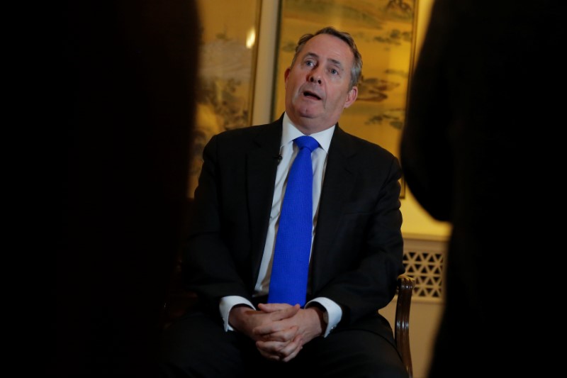 Britain's International Trade Secretary Liam Fox speaks during an interview at the residence of the British embassy in Beijing