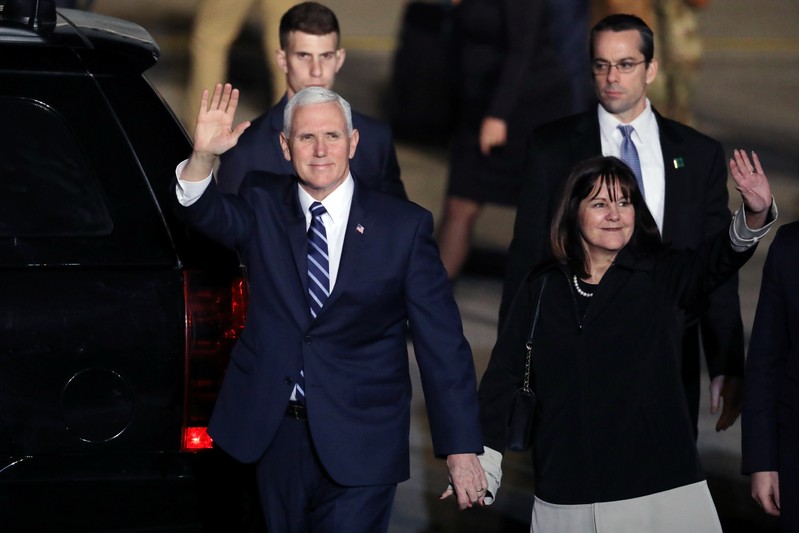 U.S. Vice President Mike Pence and his wife Karen wave upon their arrival at Ben Gurion international Airport in Lod, near Tel Aviv