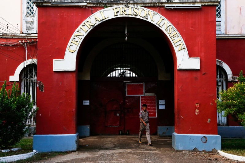 A security officer walks in front of Insein Prison in Yangon