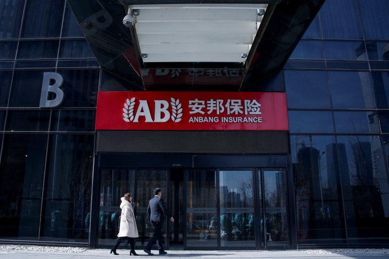 People enter the office of Anbang Insurance Group in Beijing