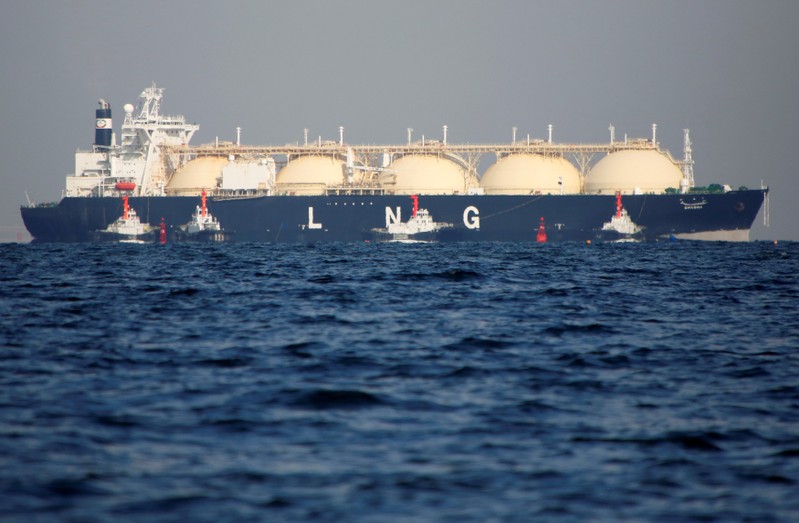FILE PHOTO: A LNG tanker is tugged towards a thermal power station in Futtsu