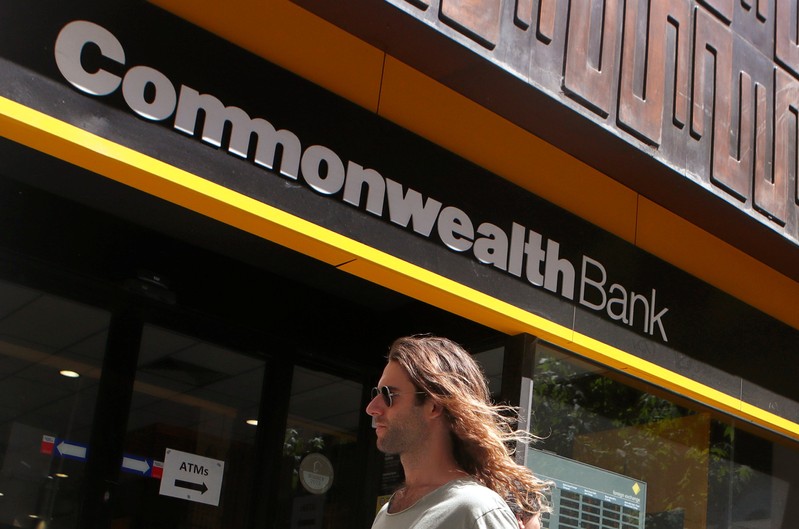 A man walks past a branch of the Commonwealth Bank of Australia in central Sydney
