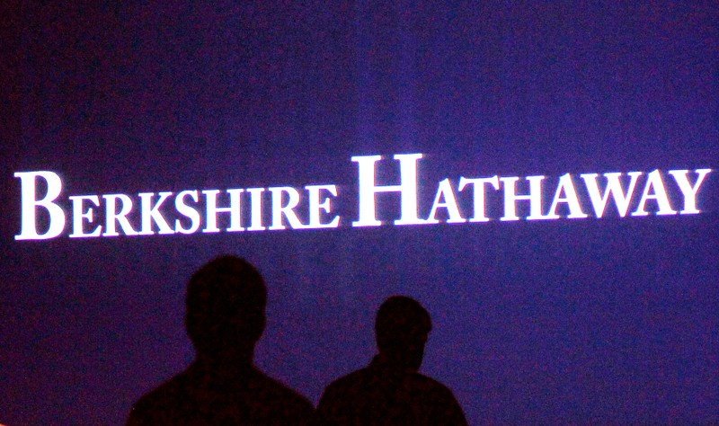 FILE PHOTO: Berkshire Hathaway shareholders walking by a video screen at the company's annual meeting in Omaha