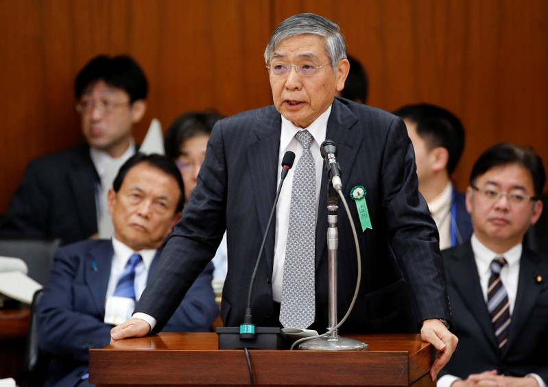 BOJ Governor Kuroda speaks next to Japan's DPM and Finance Minister Aso during a financial and monetary committee session at the Lower House of the parliament in Tokyo