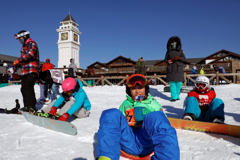 Visitors get ready for skiing at Nanshan ski resort, east of Beijing
