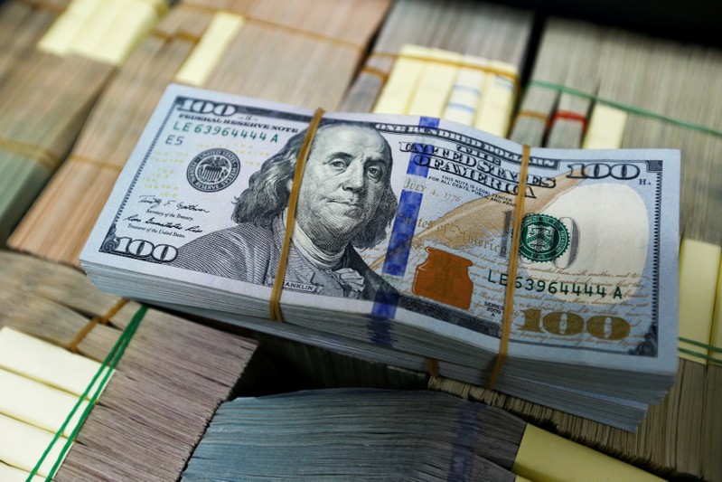 FILE PHOTO: U.S. dollar notes are seen at a Kasikornbank in Bangkok