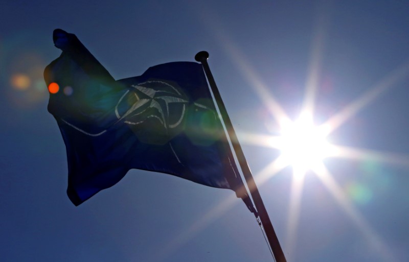 FILE PHOTO - A NATO flag flies at the Alliance's headquarters in Brussels