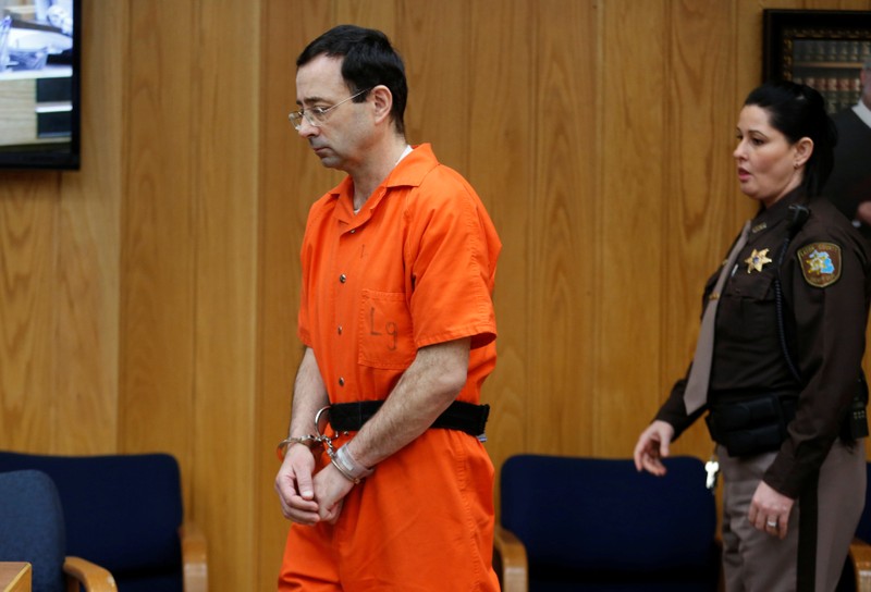 Larry Nassar, a former team USA Gymnastics doctor who pleaded guilty in November 2017 to sexual assault charges, enters the courtroom during his sentencing hearing in the Eaton County Court in Charlotte, Michigan,