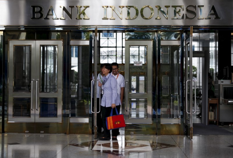 FILE PHOTO People walk out of a building inside the Bank Indonesia complex in Jakarta, Indonesia