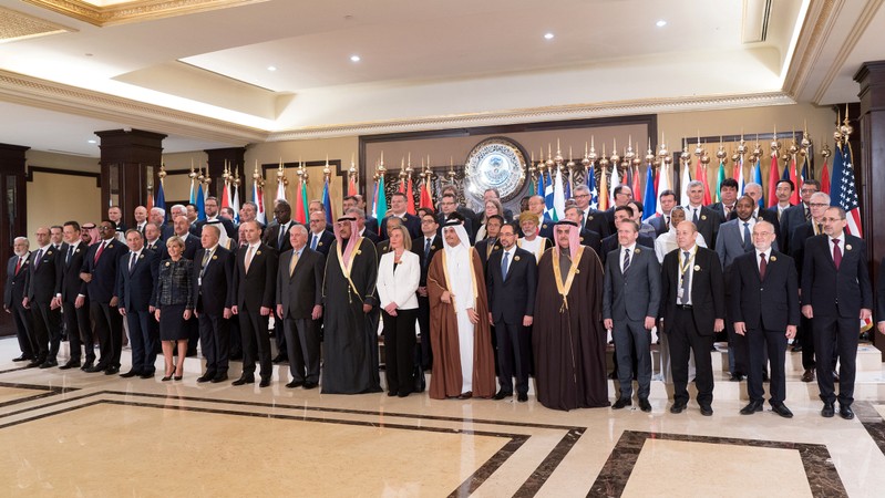 Kuwait Minister of Foreign Affairs Al Sabah poses for a group photo with U.S. Secretary of State Tillerson and other Foreign Ministers and delegates ahead of the Kuwait International Conference for Reconstruction of Iraq, in Bayan