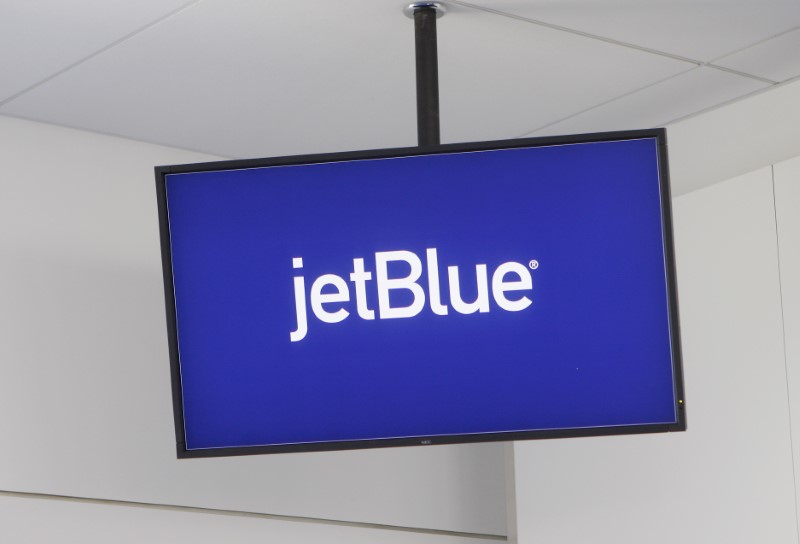 FILE PHOTO: JetBlue Airways logo is displayed on a monitor in Terminal 5 at JFK International Airport in New York