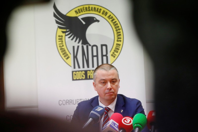 Anti-corruption agency head Straume listens to media in Riga