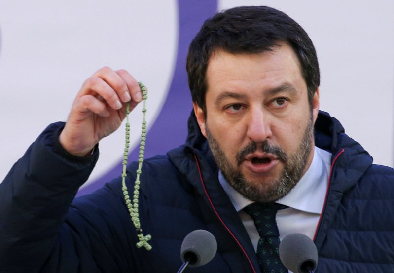 Italian Northern League leader Matteo Salvini shows a rosary as he speaks during a political rally in Milan