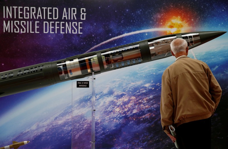FILE PHOTO: A man looks at a Patriot Advanced Capability (PAC-3) Missile Segment Enhancement (MSE) model by Lockheed Martin at an international military fair in Kielce