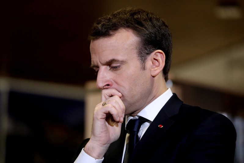 French President Emmanuel Macron visits a mediatheque in Les Mureaux, Paris suburb