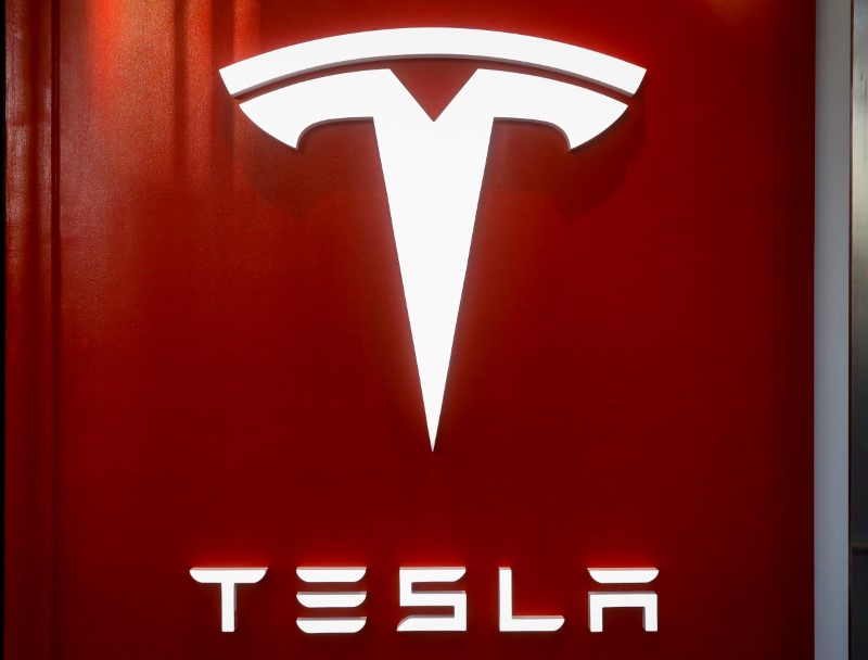 The Tesla logo is seen at the entrance to Tesla Motors' new showroom in Manhattan's Meatpacking District in New York City