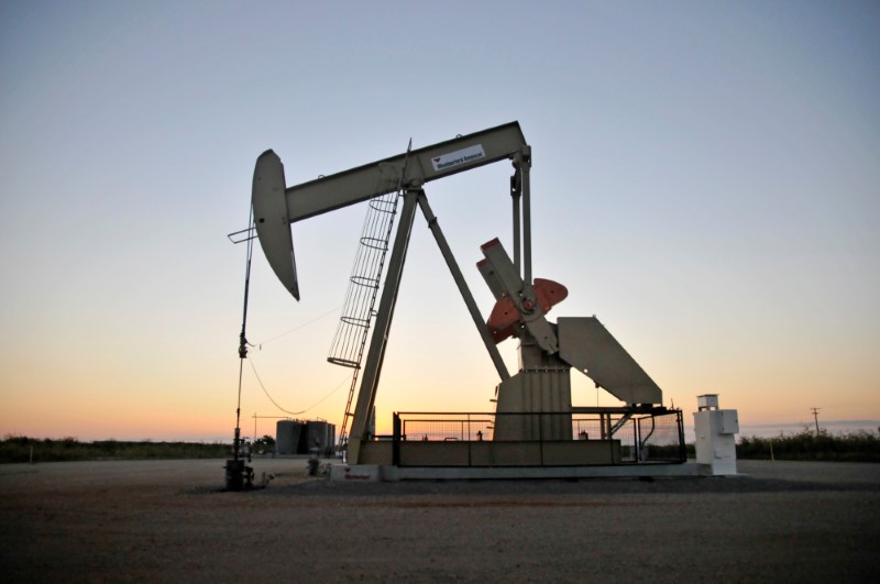 FILE PHOTO: A pump jack operates at a well site leased by Devon Energy Production Company near Guthrie,