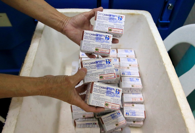 FILE PHOTO: A health worker shows unused packs of anti-dengue vaccine Dengvaxia at the Manila Health Department in Sta Cruz