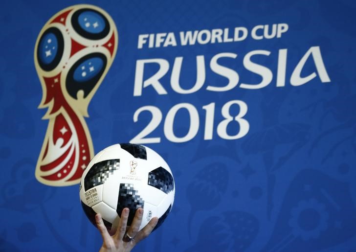 FILE PHOTO: A presenter holds the official match ball for the 2018 FIFA World Cup Russia during an event to announce the new 2018 FIFA Fan Fest Ambassadors in Moscow
