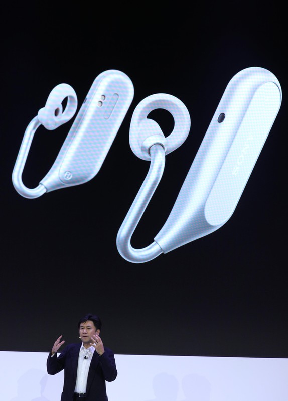 Hideyuki Furumi, Executive Vice President Global Sales & Marketing, Sony Mobile Communications, presents the Xperia Ear Duo earbuds during the Mobile World Congress in Barcelona